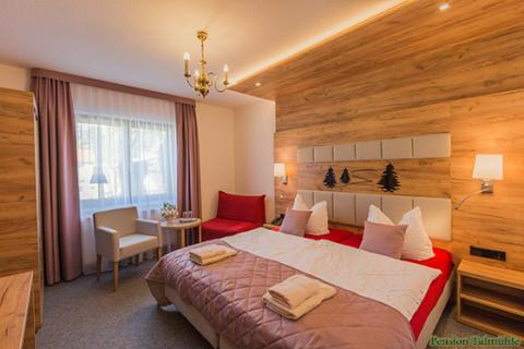 Genießen Sie den Aufenthalt in den gemütlich-modernen Zimmern Gemütliche Zimmer in der Pension